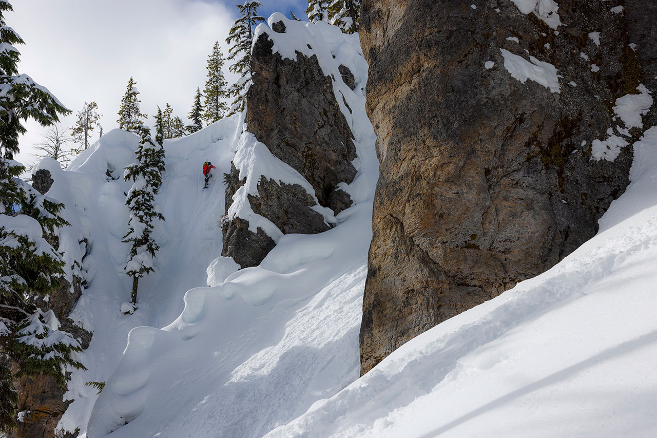 skiier heading down the backcountry