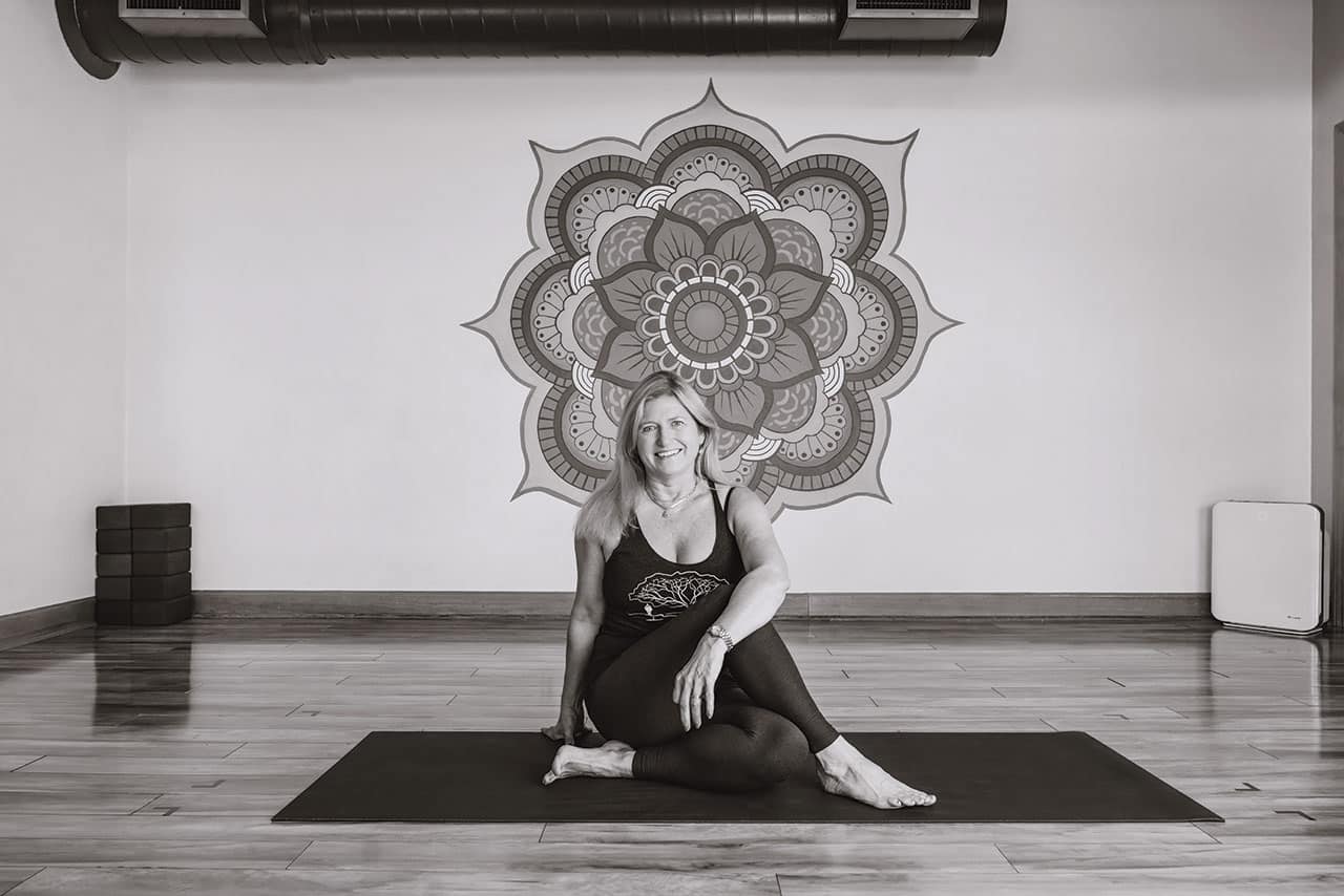 Yoga Namaspa woman doing pose on yoga mat