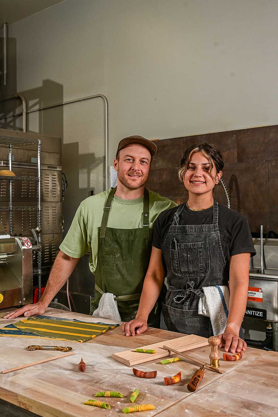 Gabriel Rossi and Annette Solis pose while making handmade pasta