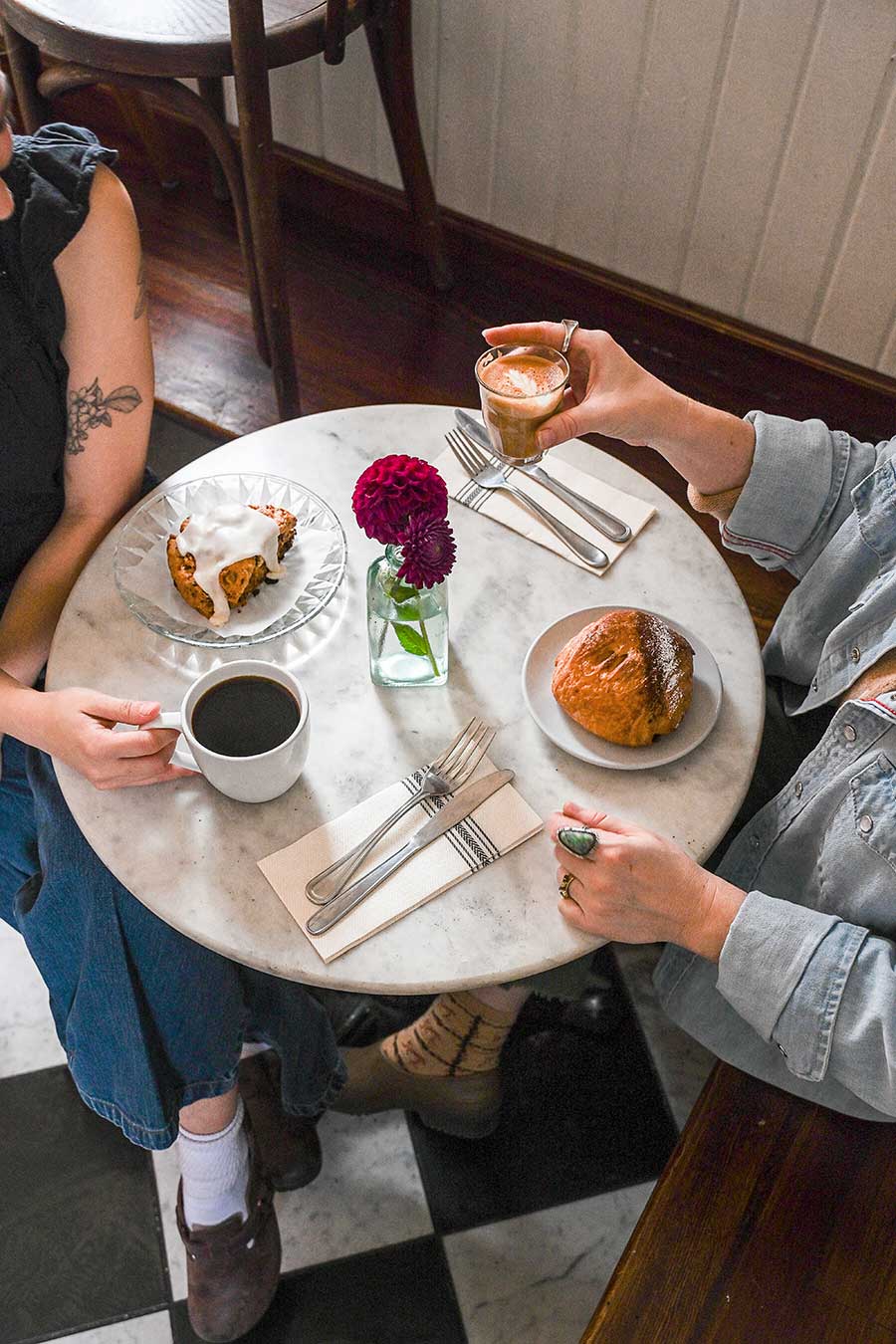 coffee and pastries on marble table at cafe des Chutes