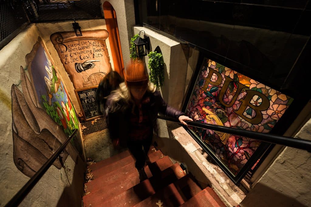 Two people walking back upstairs from the Underground Book Gallery in Bend