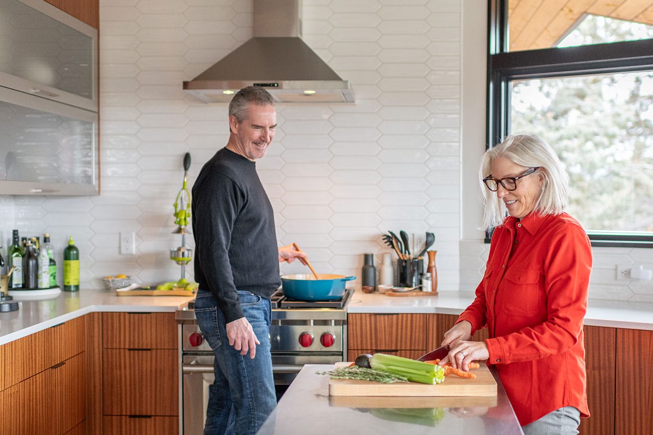 Stacy and Richard Lyon cooking in their kitchen