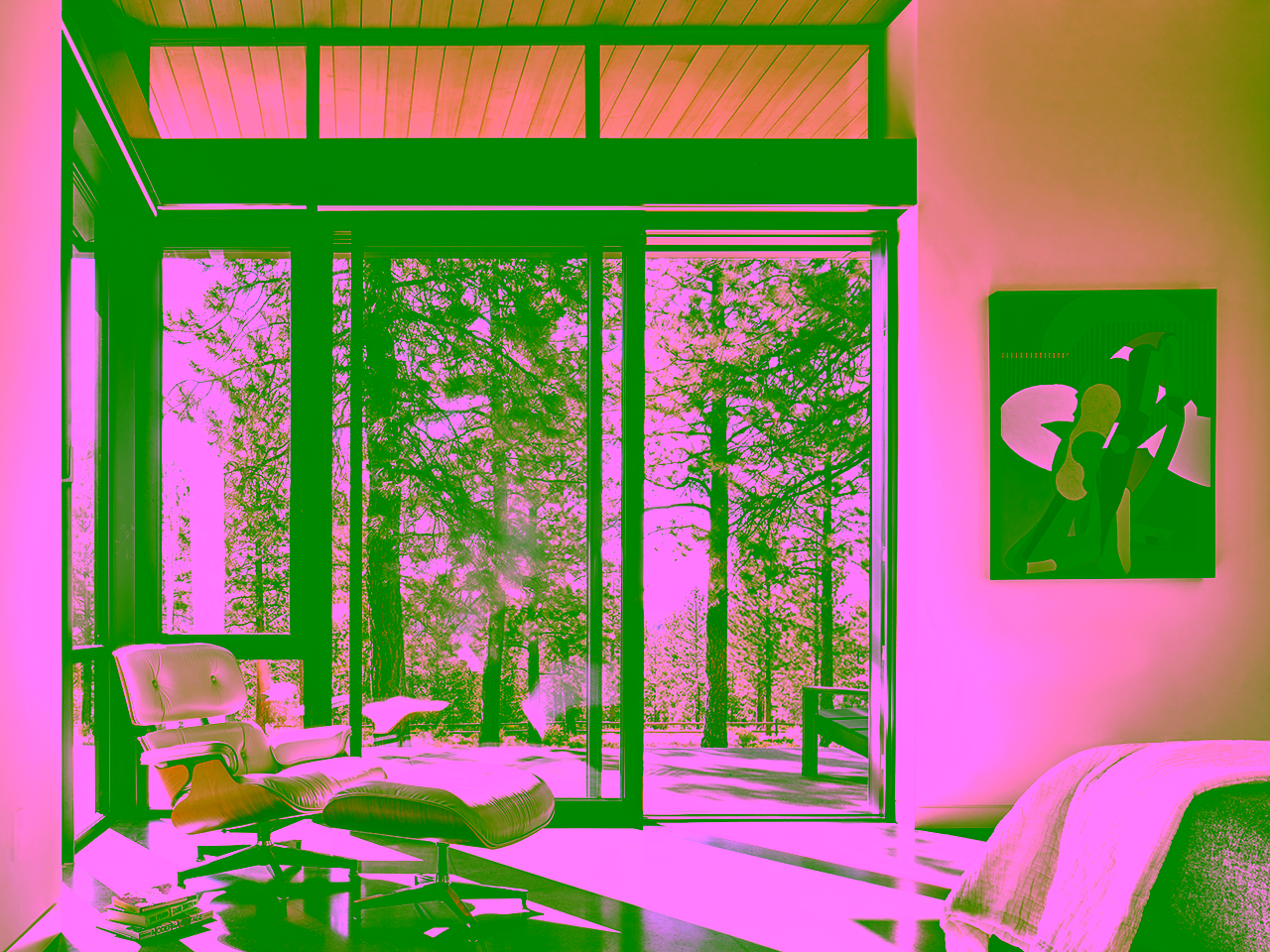 Glass-walled breezeway connecting two wings of modern mountain home in Bend