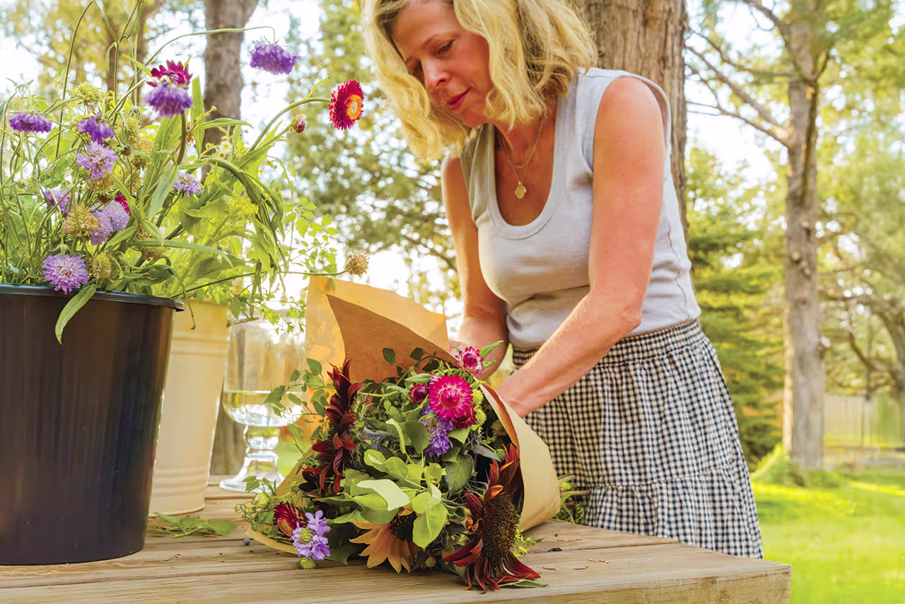 Chrissy Capri Snider, Tumalo Flower Farm putting together a flower bouquet.