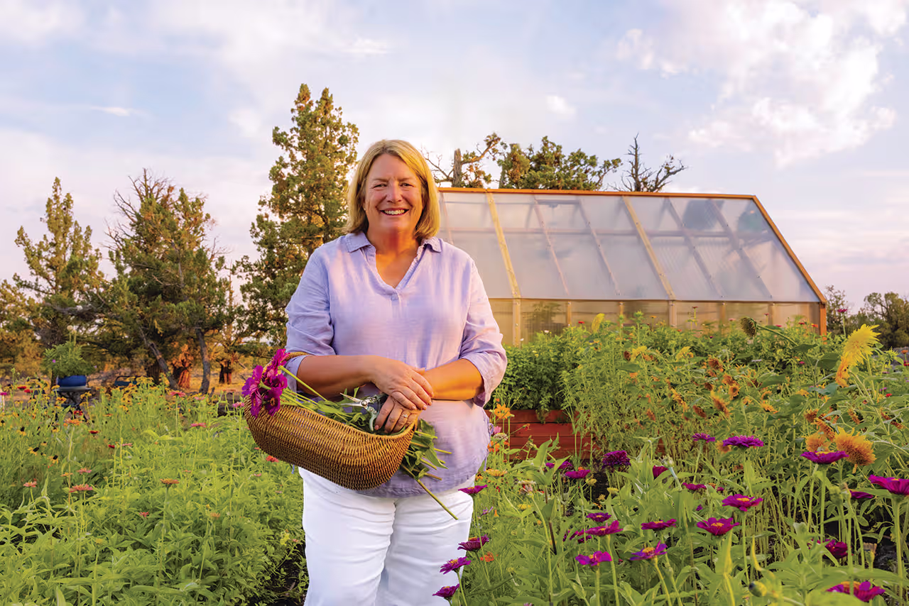 Amy Ochander of Windy Ridge Lavender. Holding a basket of flowers