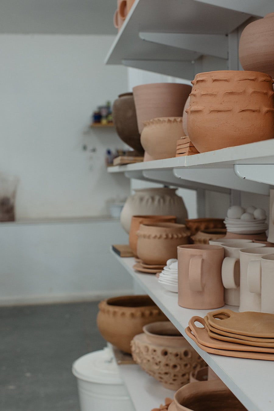 Shelf full of HWH Ceramics works