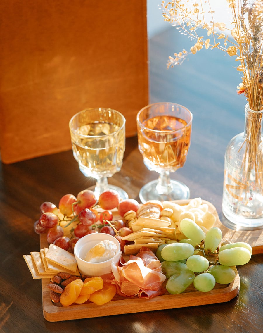 2 glasses of Lazy Z Ranch Mead with a charcuterie Board