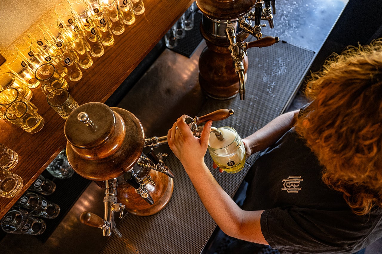 Bartender pouring beers at Van Henion Brewing in Bend