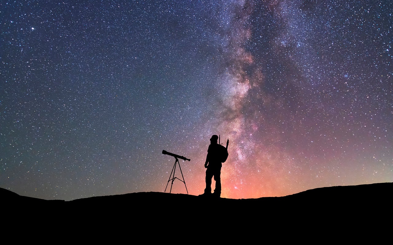 photographer silhouette dark sky