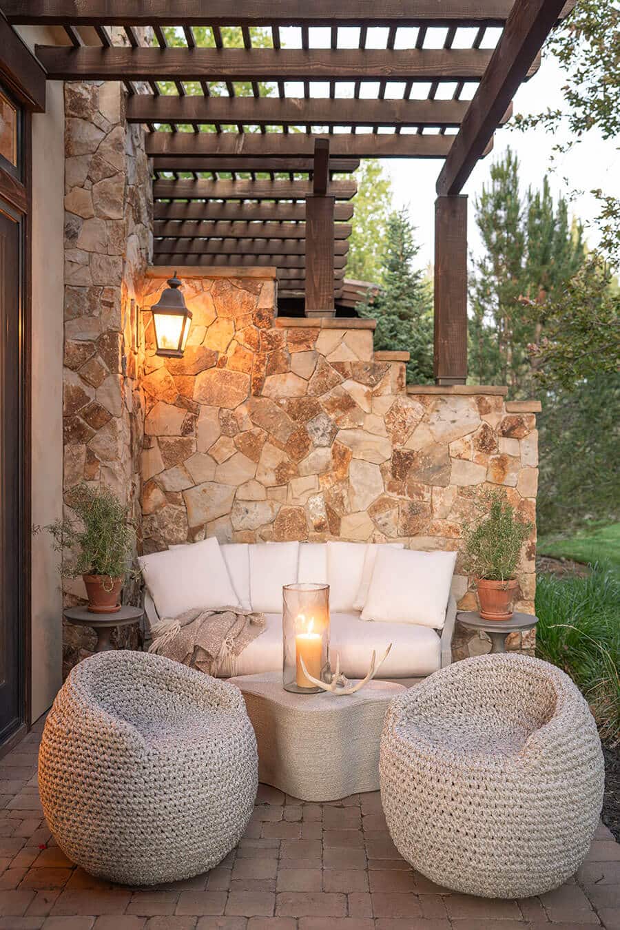Rosati home back patio with couch and two pouf chairs