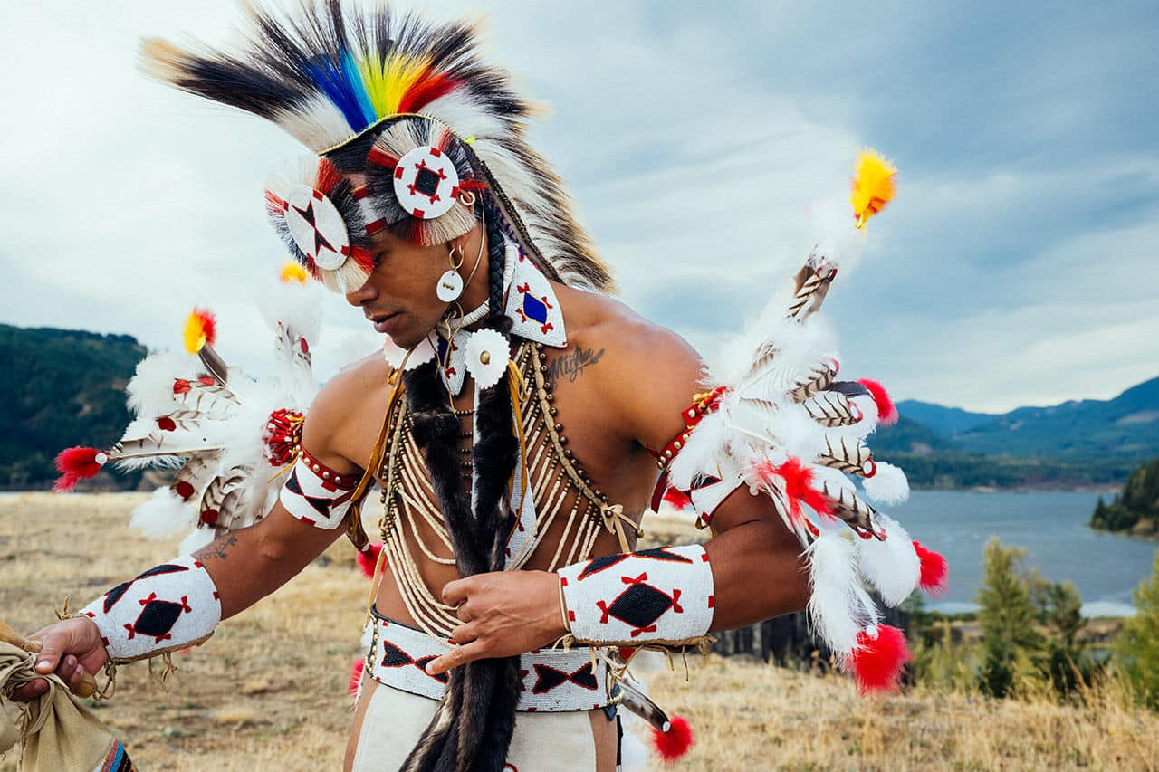 A Black Nez Perce man, Kellen Trenal, wearing traditional regalia.