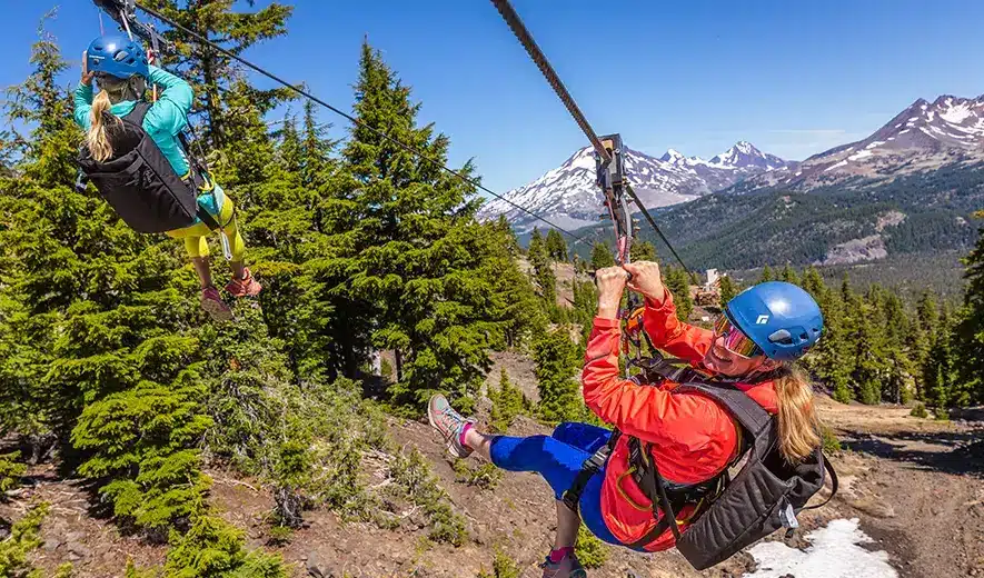 Two women on the Mt. Bachelor zip line