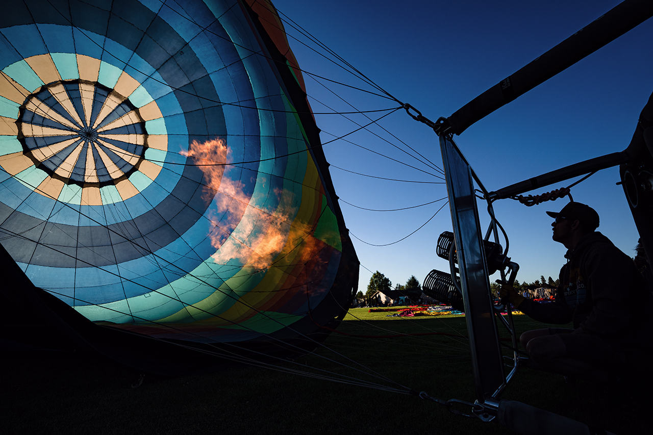 Air balloon pilot lighting the burner of a hot air balloon