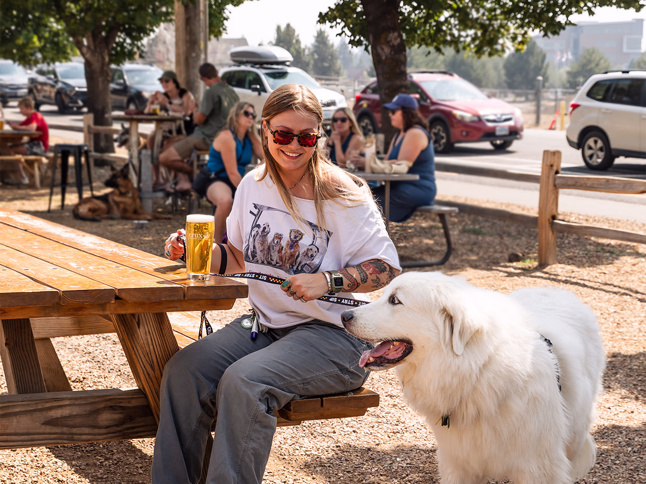 A woman and her dog at Crux Fermentation Project