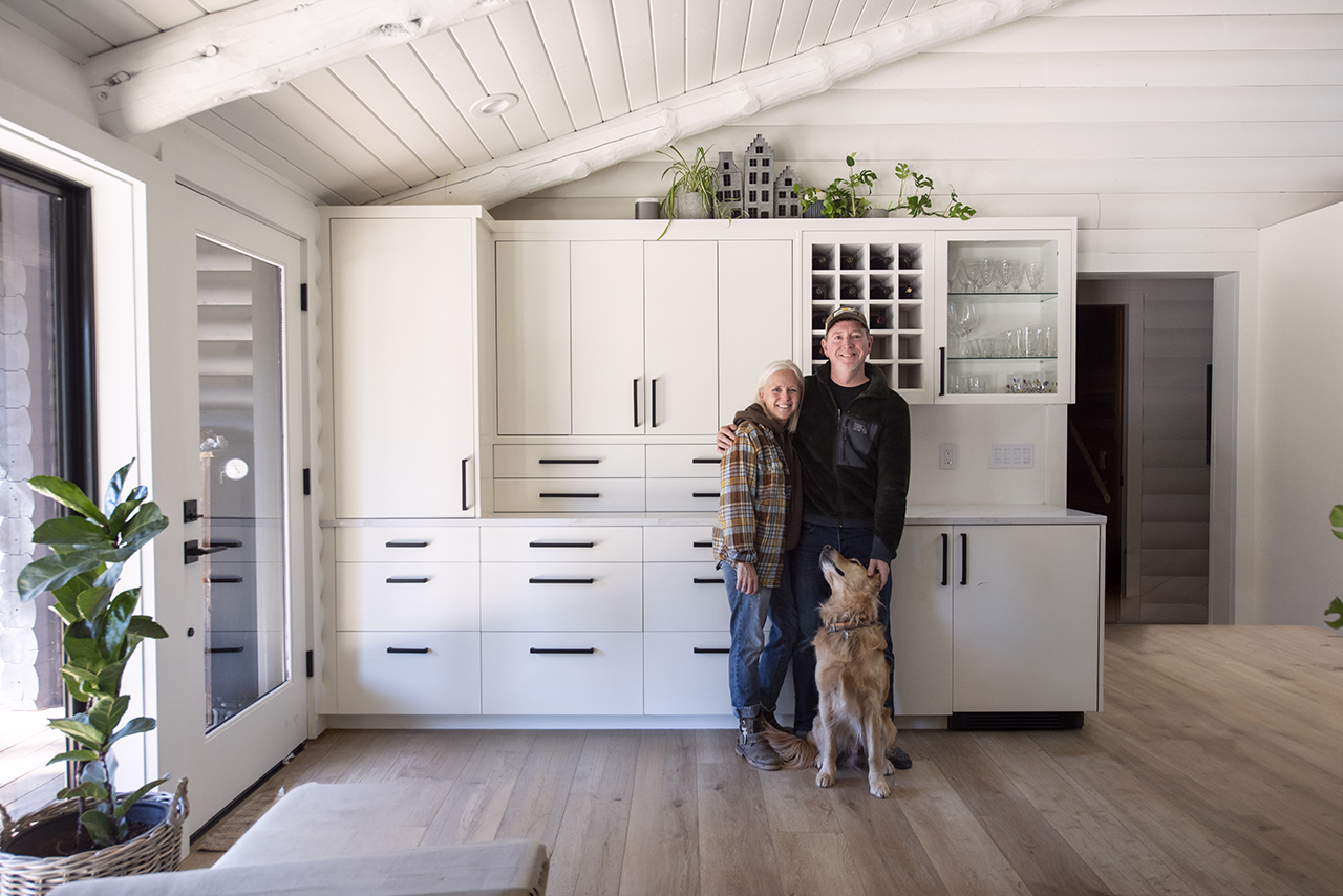 Homeowners Laura and Chris Bond with their golden retriever, Milo.