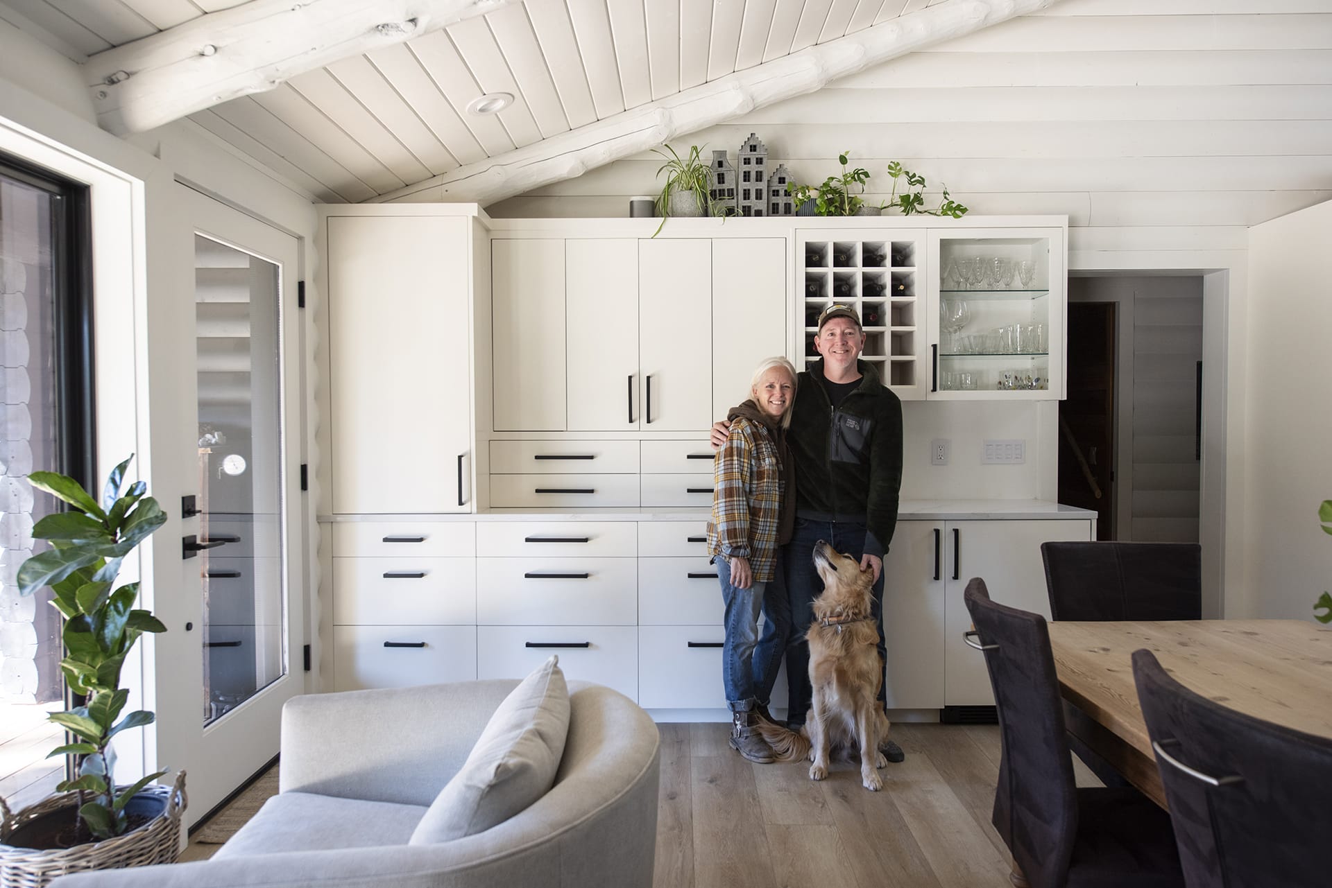 Homeowners Laura and Chris Bond with their golden retriever, Milo.