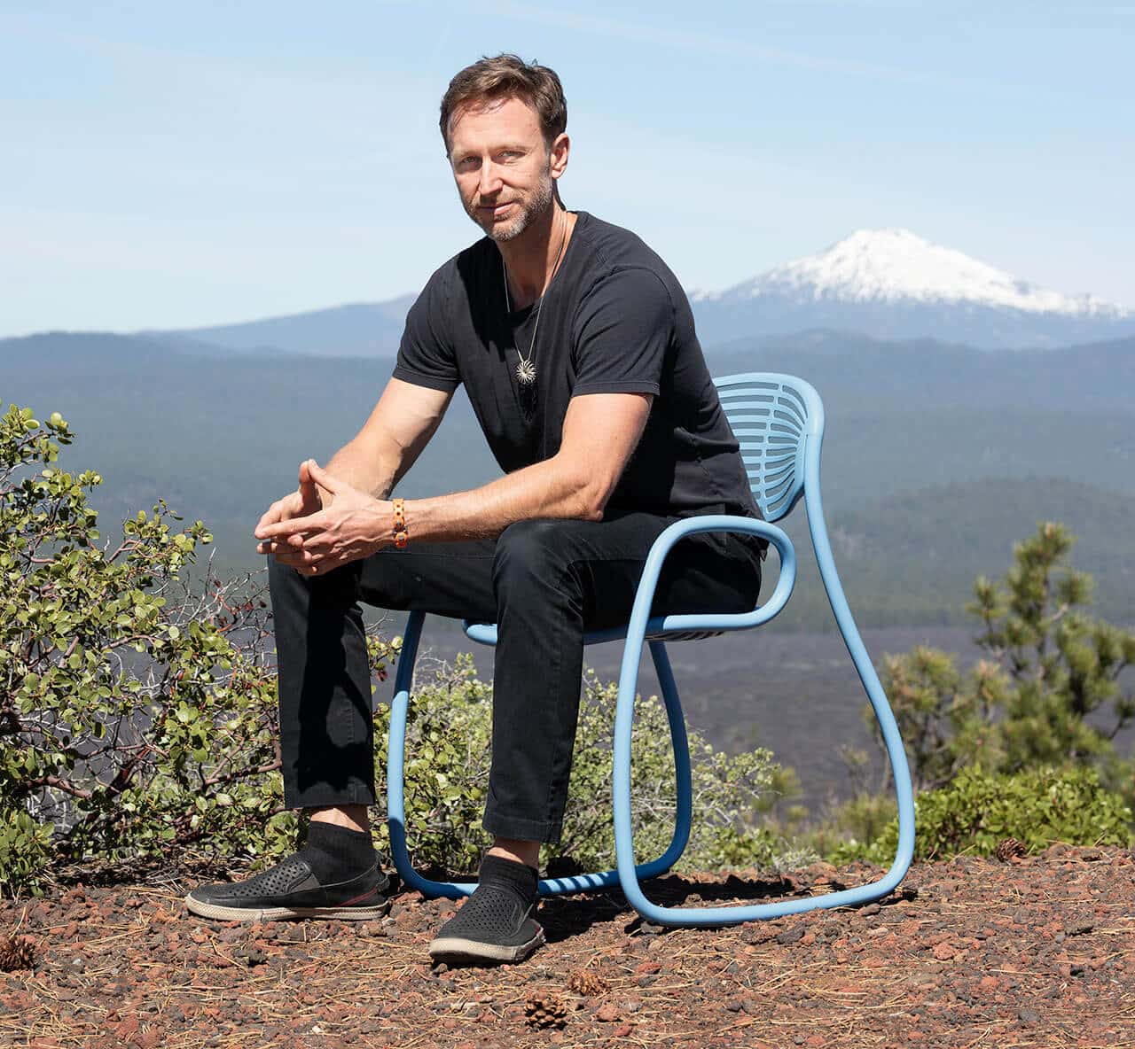 Jules Henry in Bend Oregon sitting on fr33form chair he designed and created