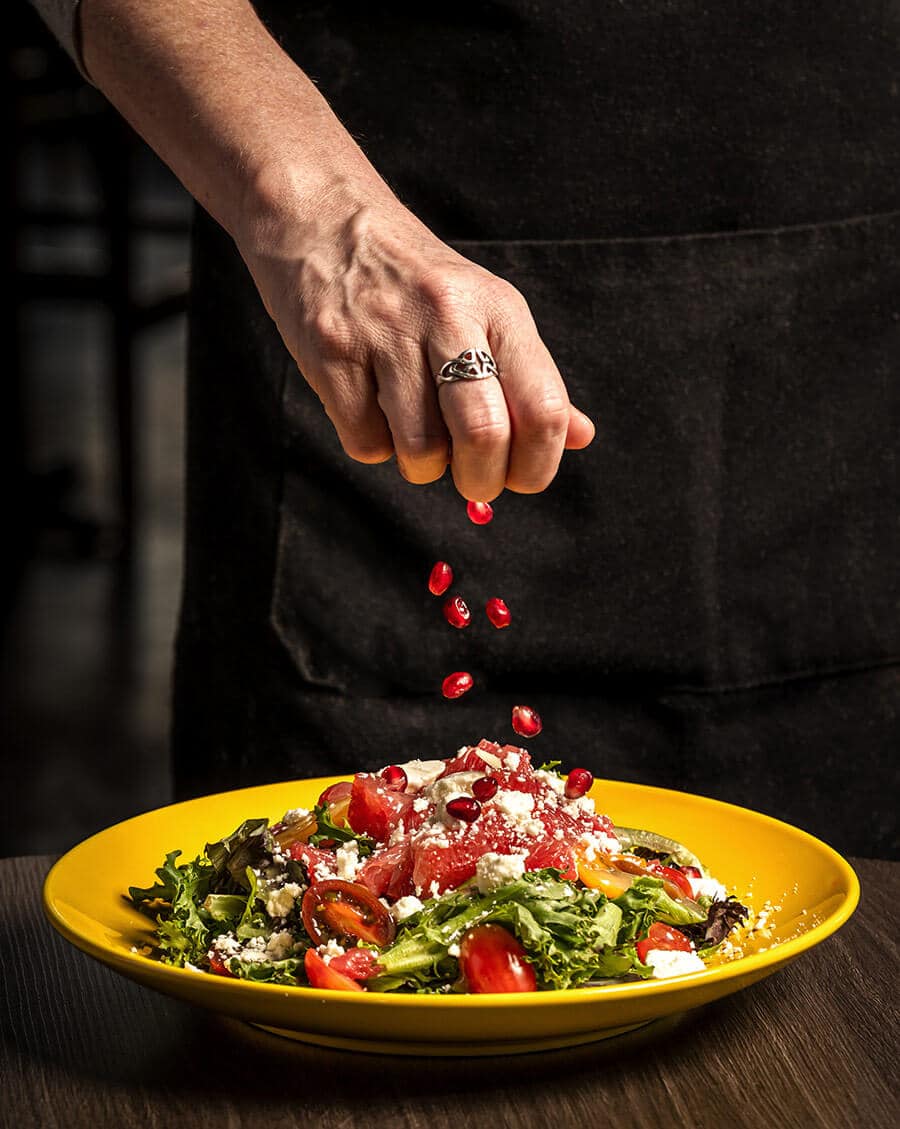 Topping the Sunset Boulevard Salad at Portello