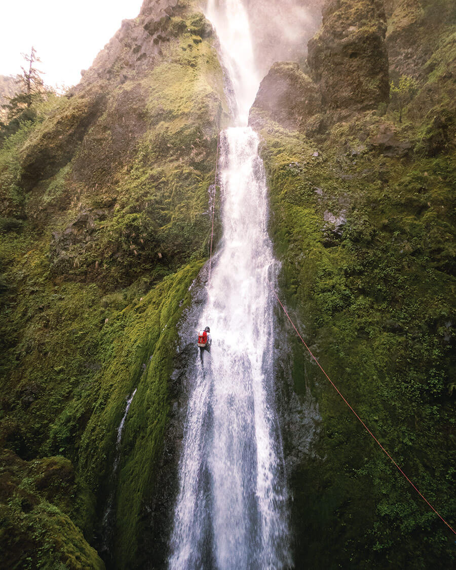 Man canyoning at Starvation Creek State Park in Oregon