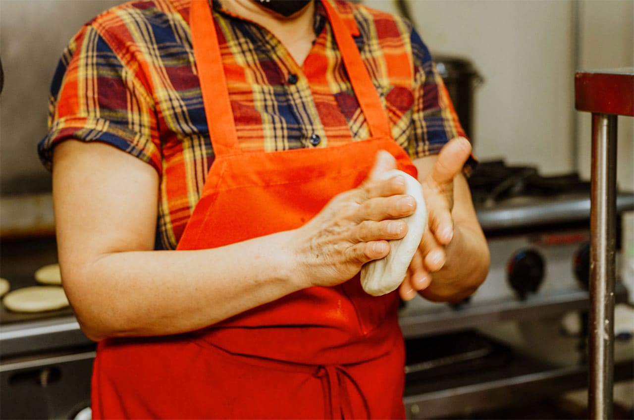 Woman making hand made tortillas