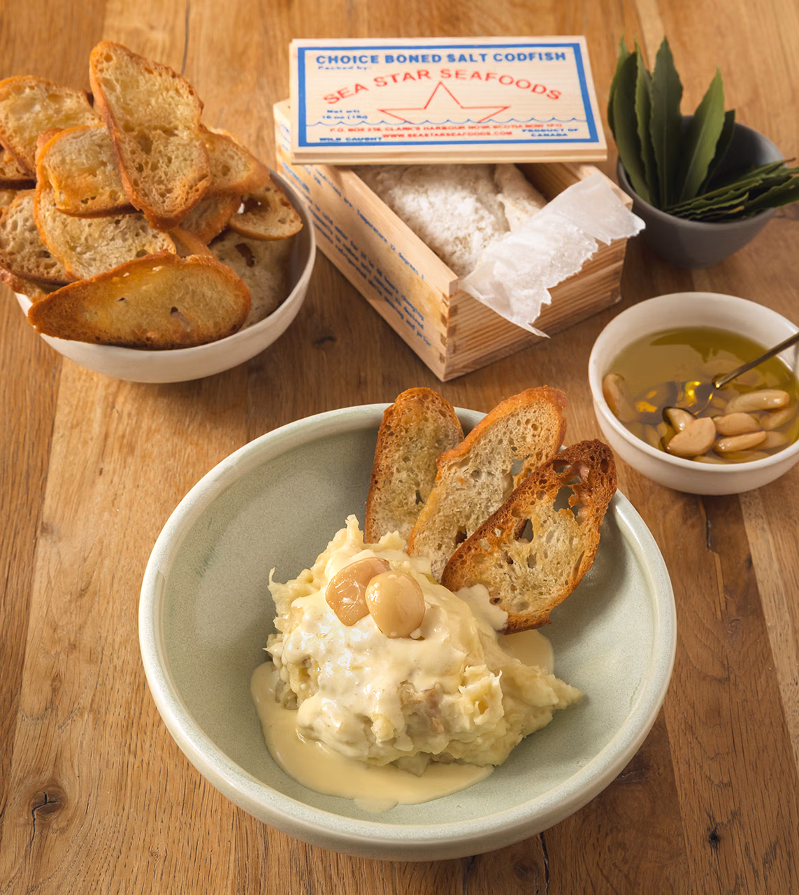 Brandade de MorueSalt Cod Brandade with Reduced Cream, Confit Garlic & Garlic-Rubbed Baguette Croutons