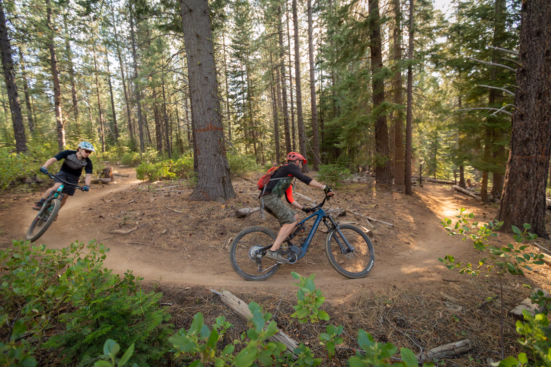 An acoustic cyclist and e-biker ride together on Storm King in Central Oregon