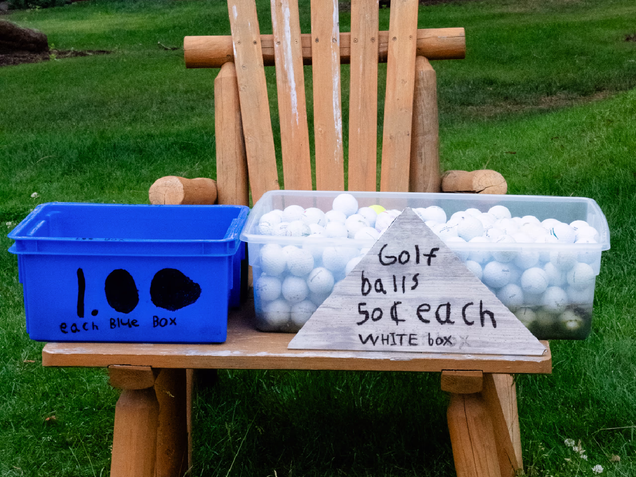 Ethan sells golf balls at Aspen Lakes Golf Course, on the honor system